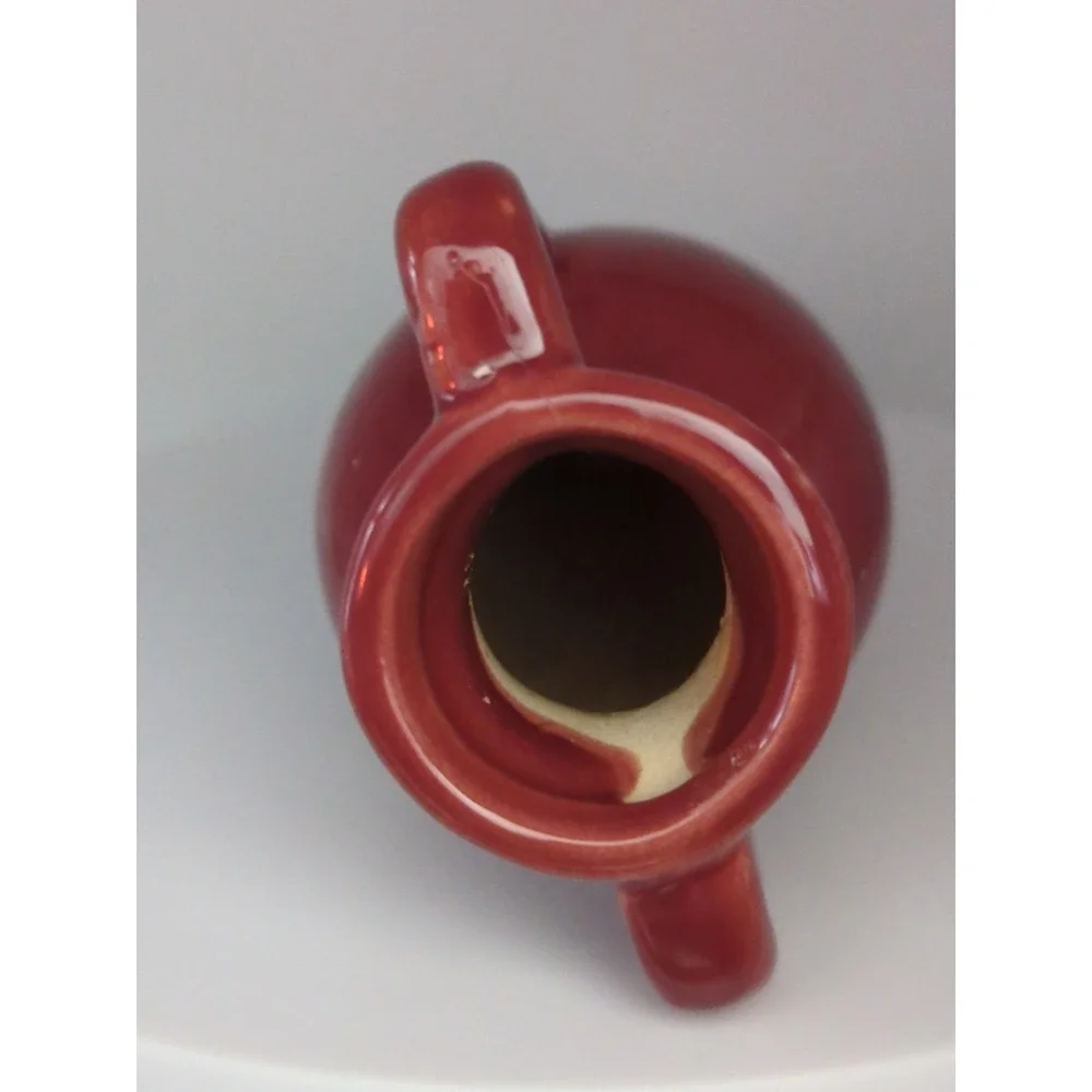 Unmarked burgundy pottery